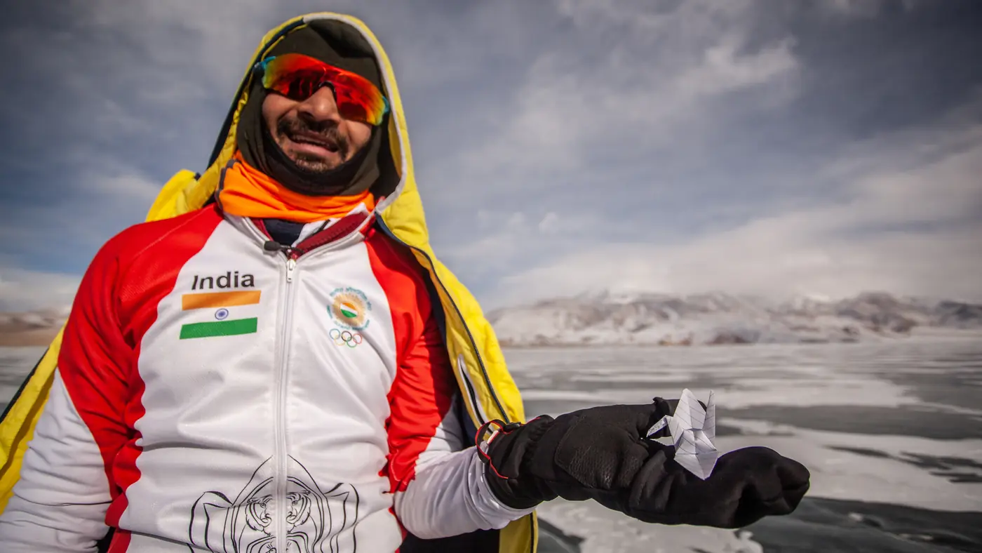 Vishwaraj Jadeja on the frozen surface of a Himalayan lake in India team kit