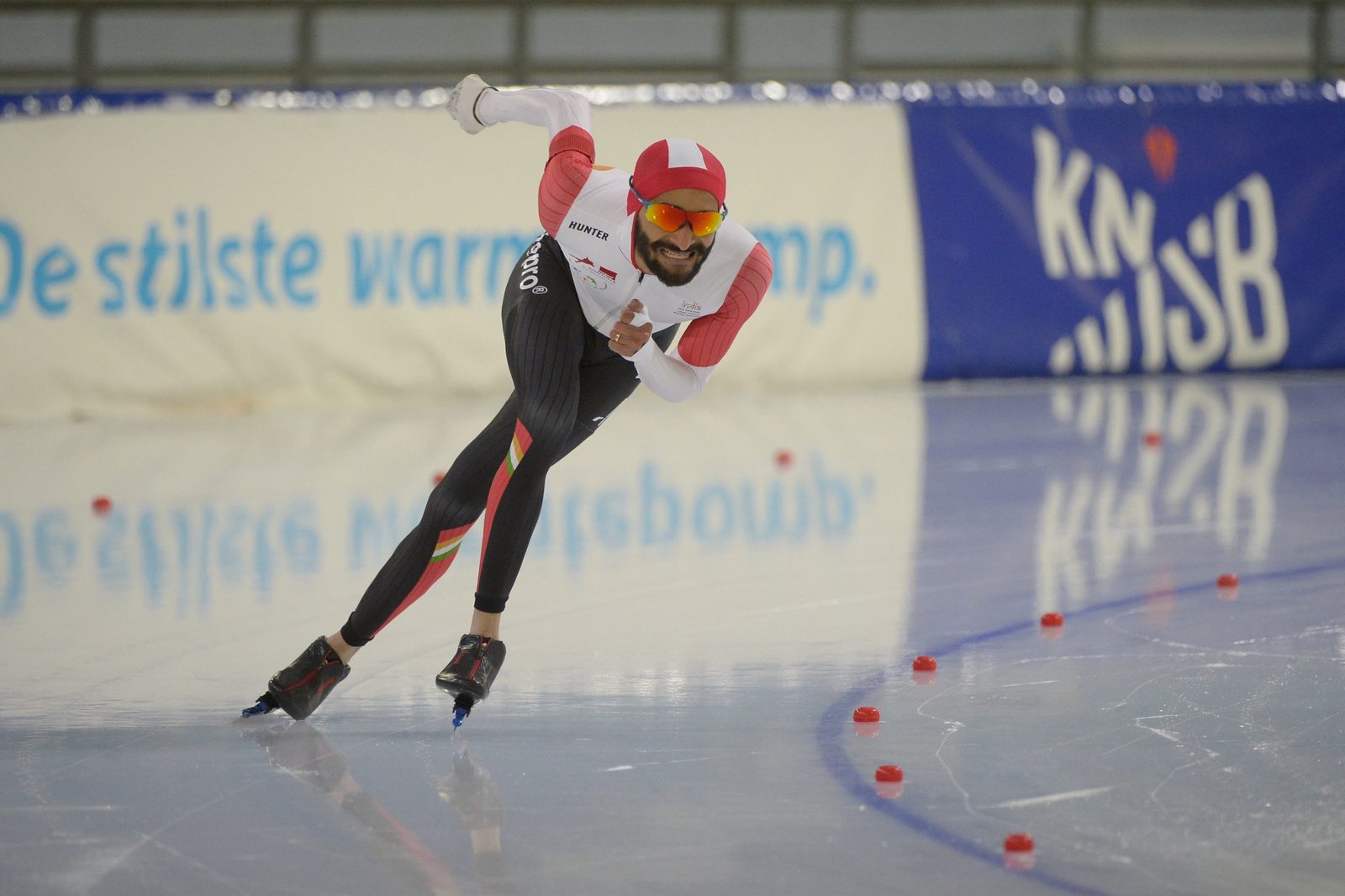 Vishwaraj driving through a corner on a Dutch long-track oval
